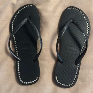 Black rhinestone studded flip flops
